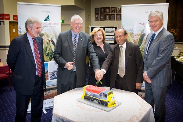 Waitakere Mayor Bob Harvey and ARTA chairman Rabin Rabindran cut the cake to celebrate New Lynn�s redevelopment funding being secured.  Also pictured are ATA executive chairman Mark Ford (left), KiwiRail deputy chair Paula Rebstock and Fletcher Building�s